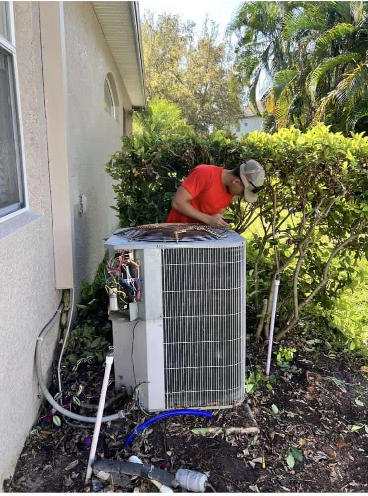 Smart Home Air & Heat technician performing AC repair and system diagnostics in Orlando