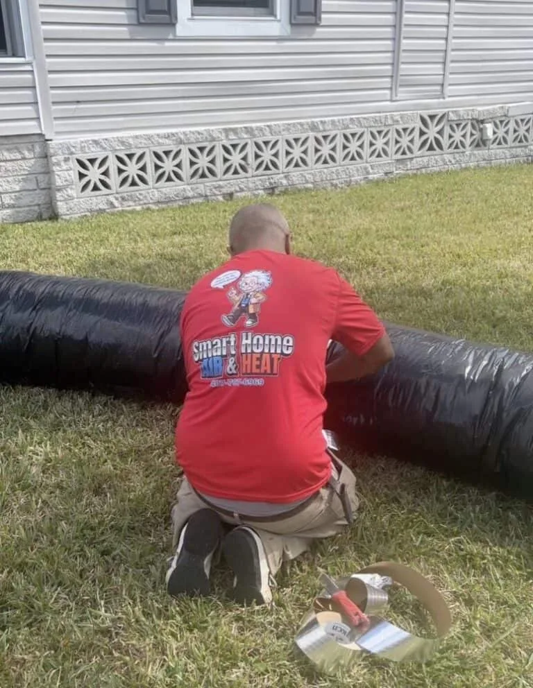 Smart Home Air & Heat certified technician performing ductwork services in East Orlando